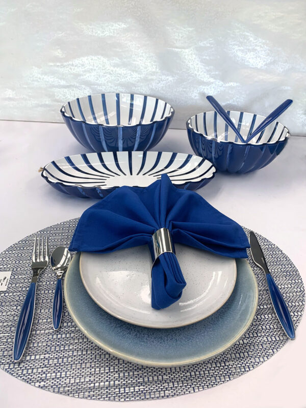 Guzzini Grace Navy/White large bowl, Xlarge bowl, tray and salad servers pictured with a dinner place setting