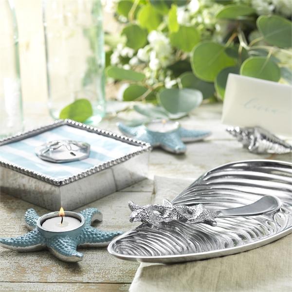 Mariposa Stacked Starfish Spreader on a serving dish paired with other sea themed items