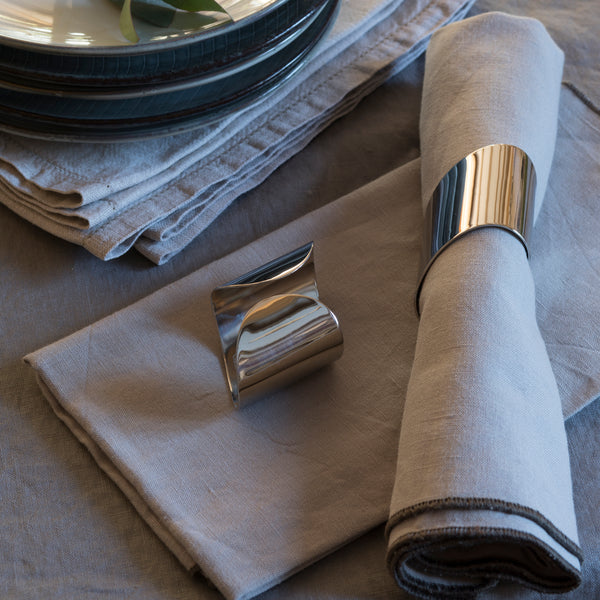 Robert Welch Radford Napkin Rings shown with a place setting