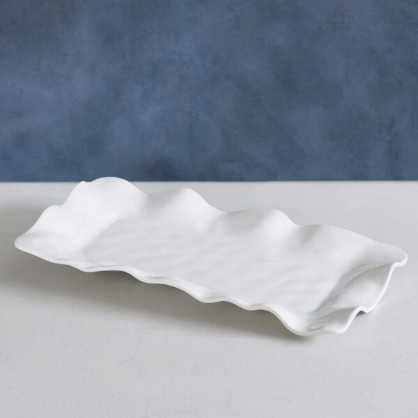 Long White Rectangular Serving Platter on table with blue wallpaper