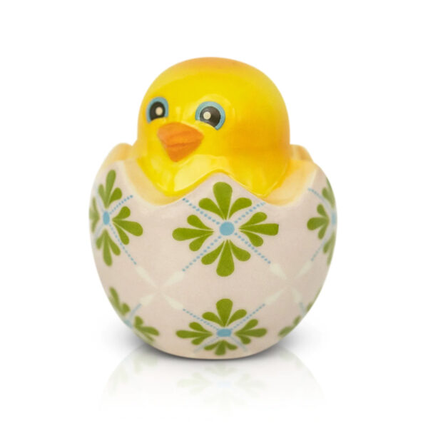 Nora Fleming mini One Cool Chick shaped like a yellow chick in a cracked eggshell