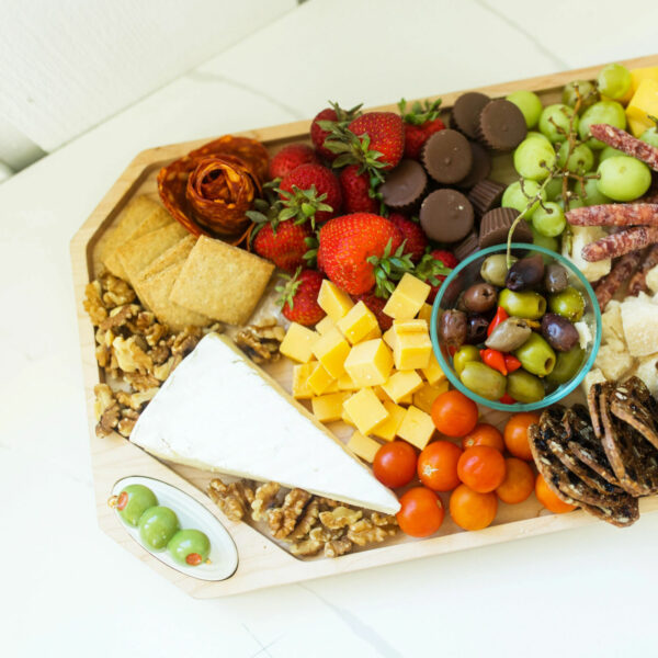 Nora Fleming Olive Mini A406 - on a charcuterie tray